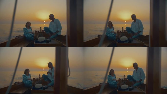 SLO MO航行到日落的幸福:一对幸福的夫妇拥抱夕阳的宁静