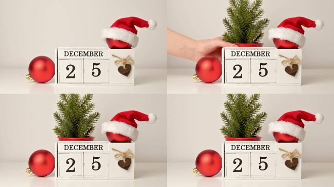静物圣诞概念。木制日历上有12月25日的日期和装饰
