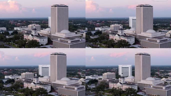 在佛罗里达州塔拉哈西历史悠久的市中心，佛罗里达州教育部和州议会大厦的黄昏。航拍镜头与广泛的平移轨道相