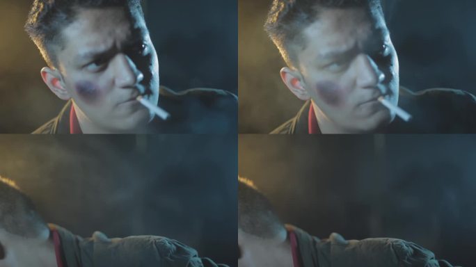 一个受伤男子的特写镜头，他嘴里叼着香烟，被人打了一拳，就像电影里的场景一样。高清视频。