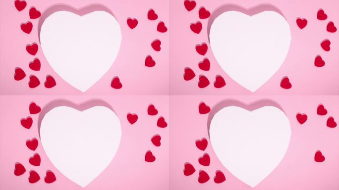 心脏的定格动画。副本的空间。爱的概念，情人节。在粉红色的背景上，许多小红心围绕着大白心移动。