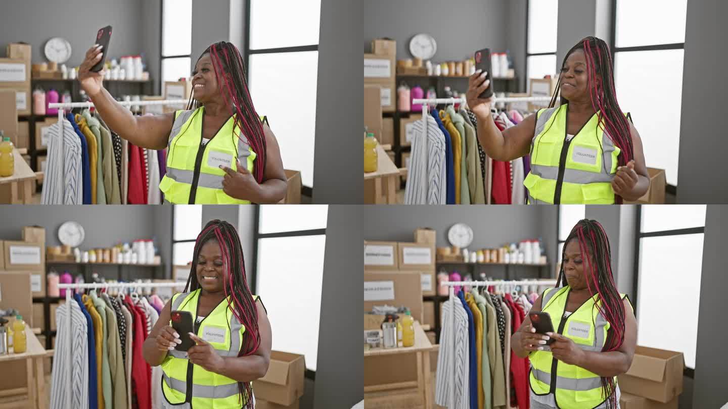 一名扎着辫子的非洲裔美国妇女在慈善中心做志愿者时，用智能手机拍了一张温暖人心的自拍