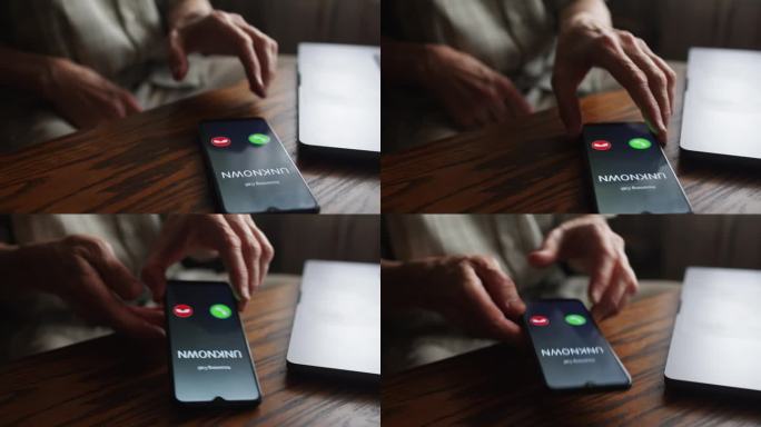 一位老人接听了一个未知号码的电话。利用智能手机概念预防诈骗。