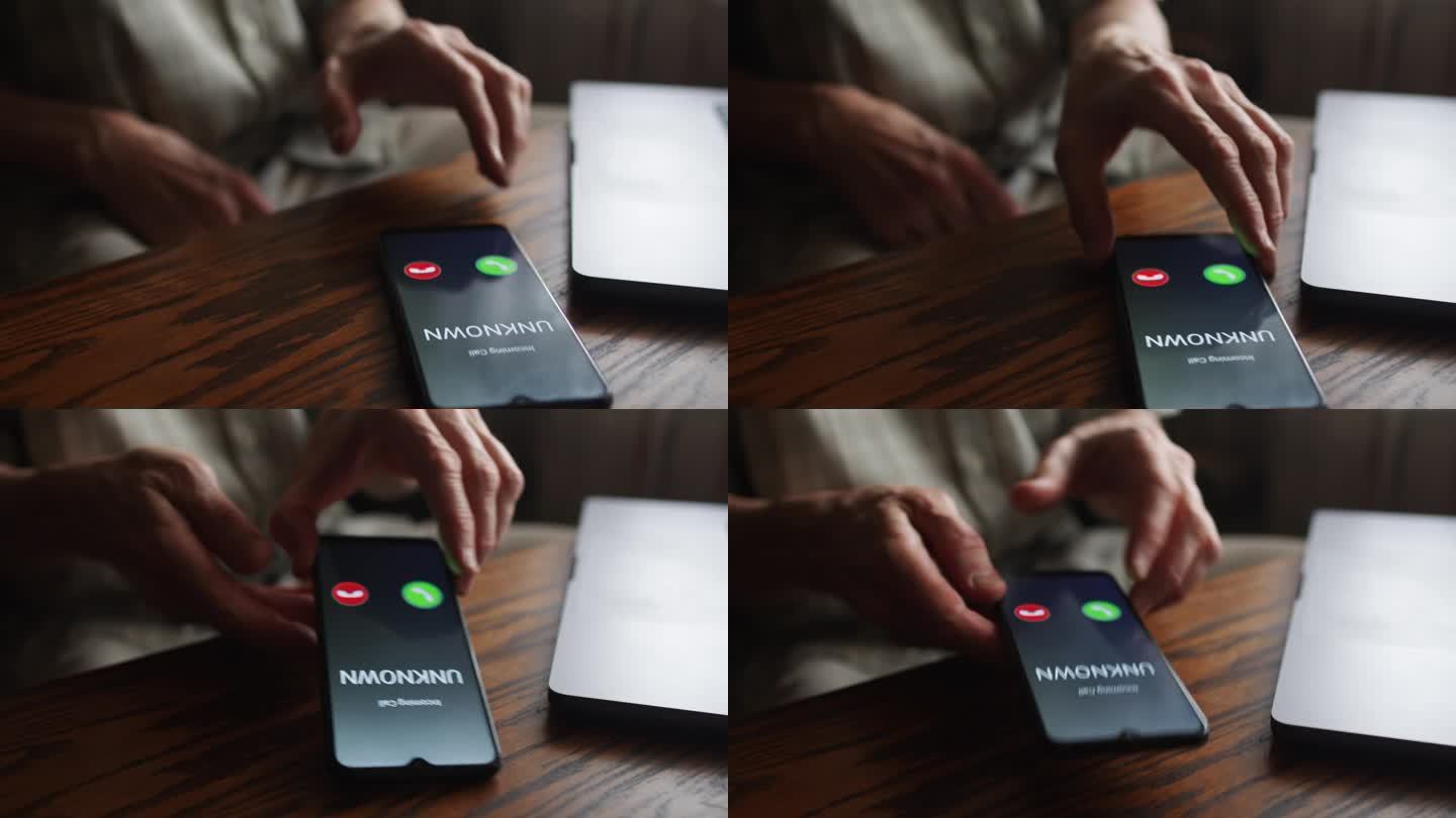 一位老人接听了一个未知号码的电话。利用智能手机概念预防诈骗。