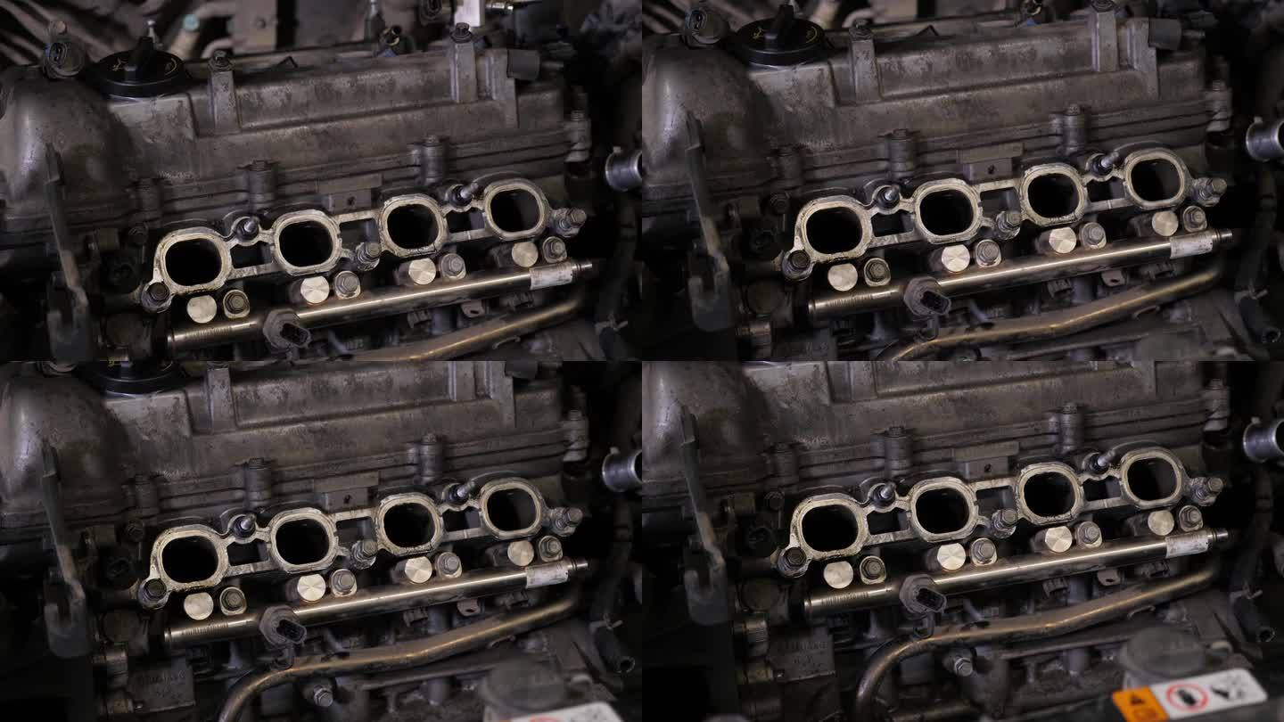 发动机在汽车引擎盖内，在汽车维修服务中心。
