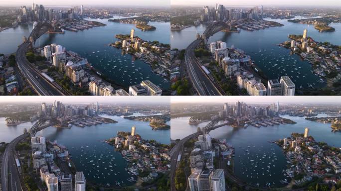 在一个阳光明媚的清晨，航拍无人机俯瞰悉尼市、悉尼港和海港大桥，俯瞰新南威尔士州的拉文德湾