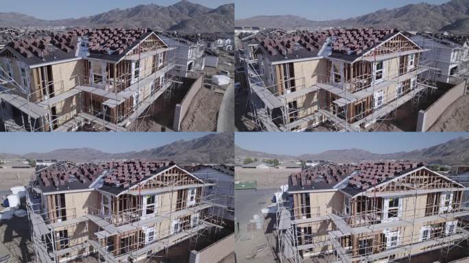 通过仔细检查，无人机揭示了建筑工地上部分建成的房屋的细节，为住宅开发的持续进展提供了细致入微的视角