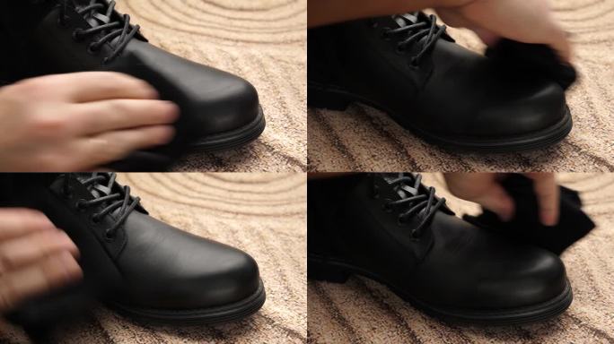 黑色皮靴上的脏东西要用毛布擦干净。鞋子护理的概念。