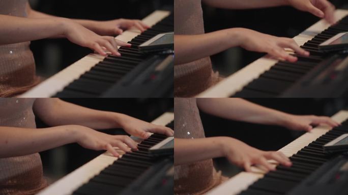 女钢琴家弹奏钢琴的特写