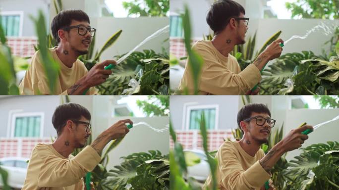 男人在家里用爱和关注浇灌盆栽植物。