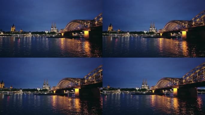德国科隆市的夜景。莱茵河、霍亨索伦桥和大教堂