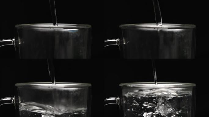 超慢速视频:将热水倒入双层玻璃杯中