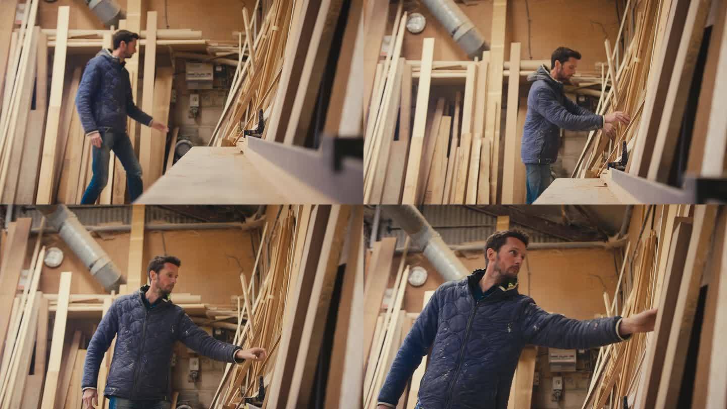 木工车间的木匠在为慢镜头拍摄的项目选择木材