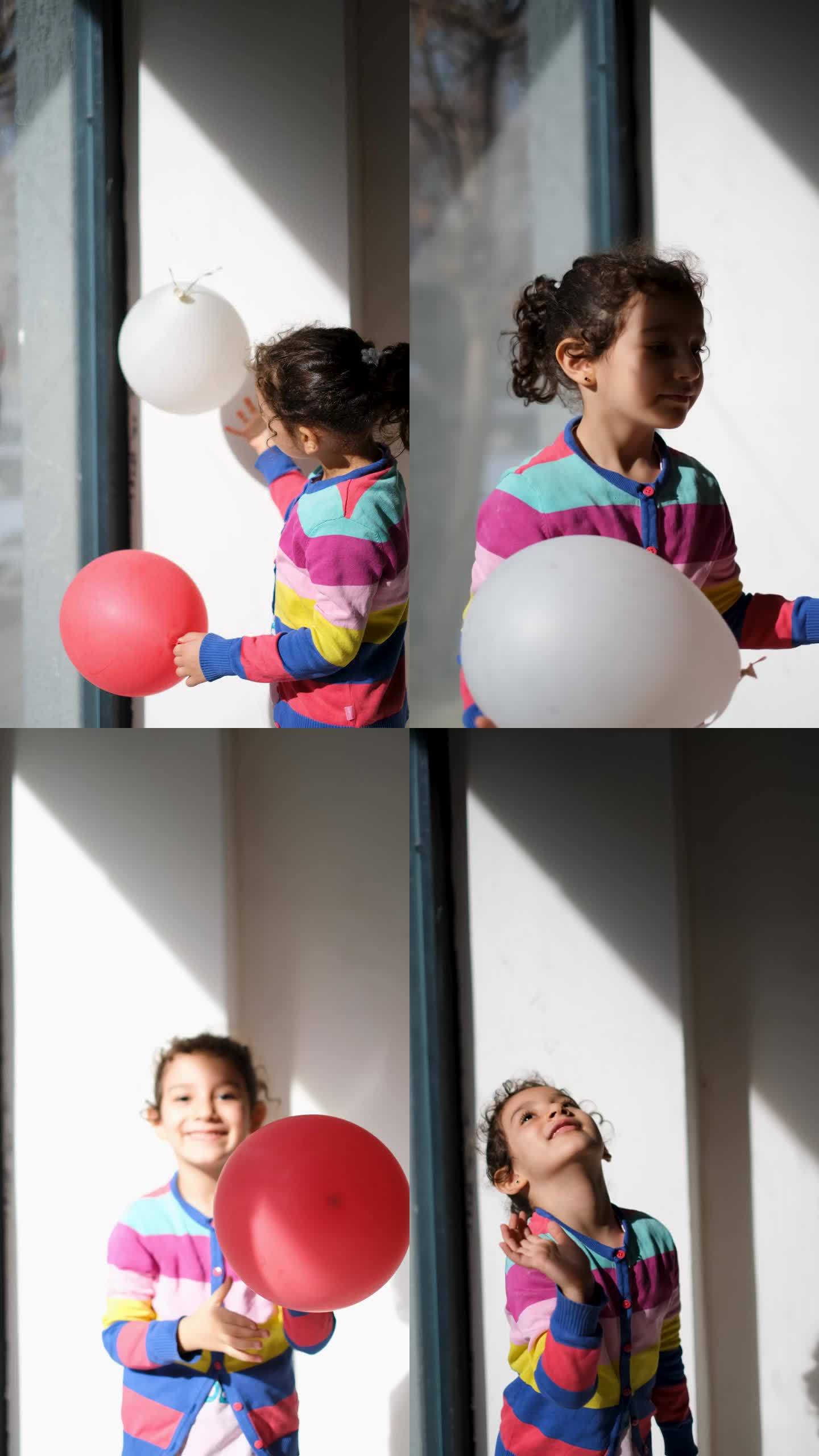 小女孩把气球扔到空中玩