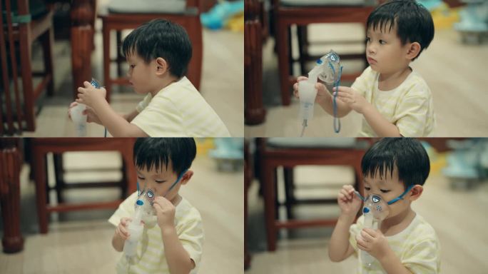 儿童呼吸系统疾病:患病的亚洲男孩在室内接受雾化器治疗。