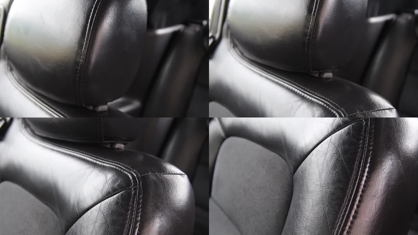豪华轿车内部的黑色皮革内饰，商务舱接缝。