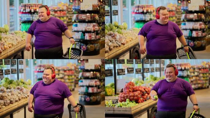 一个穿着紫色t恤，戴着红色耳机的快乐男人在超市里走来走去，一边摇头一边听音乐。听着音乐去超市玩