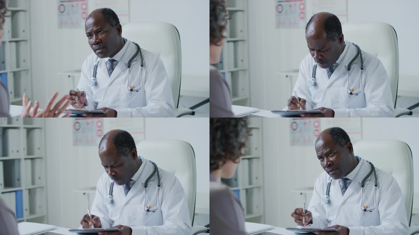 医生讨论并写下病人的健康问题