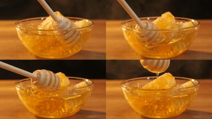 健康食品。木制蜂蜜勺。新鲜的蜂蜜滴着，从蜜罐里倒出来。