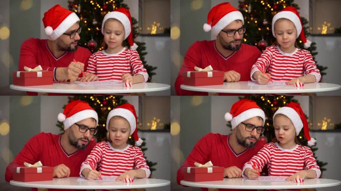 父亲和女儿在圣诞树的背景下给圣诞老人写信