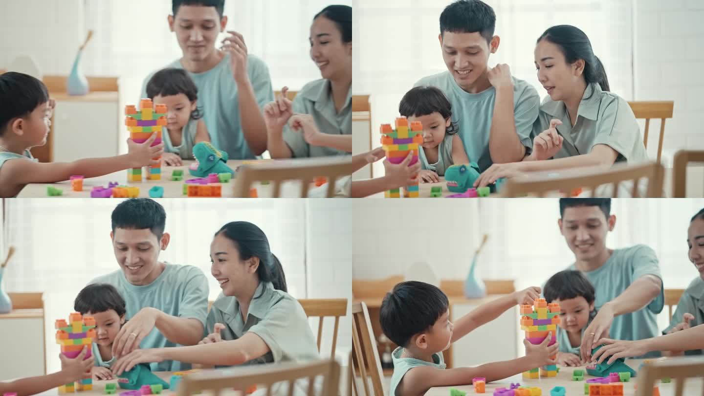 幸福的一家人，儿子和女儿在家里玩五颜六色的塑料积木