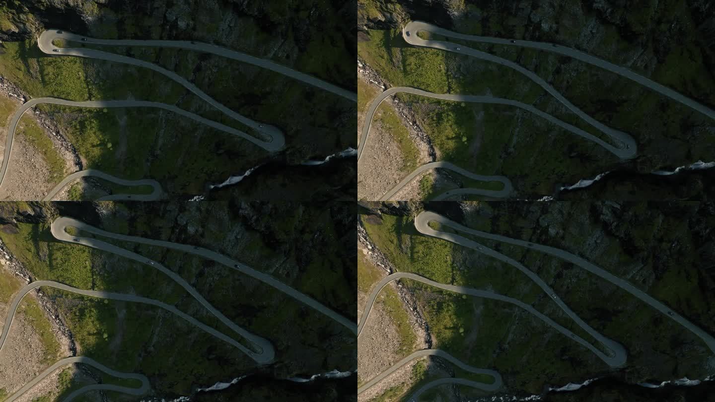 从无人机上看到巨魔斯提根蛇形公路上的发夹弯和瀑布的壮观景象
