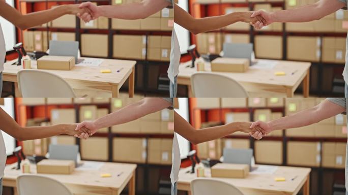 两个忠诚的西班牙裔工人在办公室里热情地握手，在打包完一个运货箱后达成协议