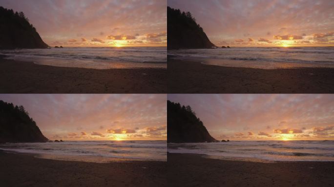 日落的天堂海滩。浪涛涌向海岸线。慢动作