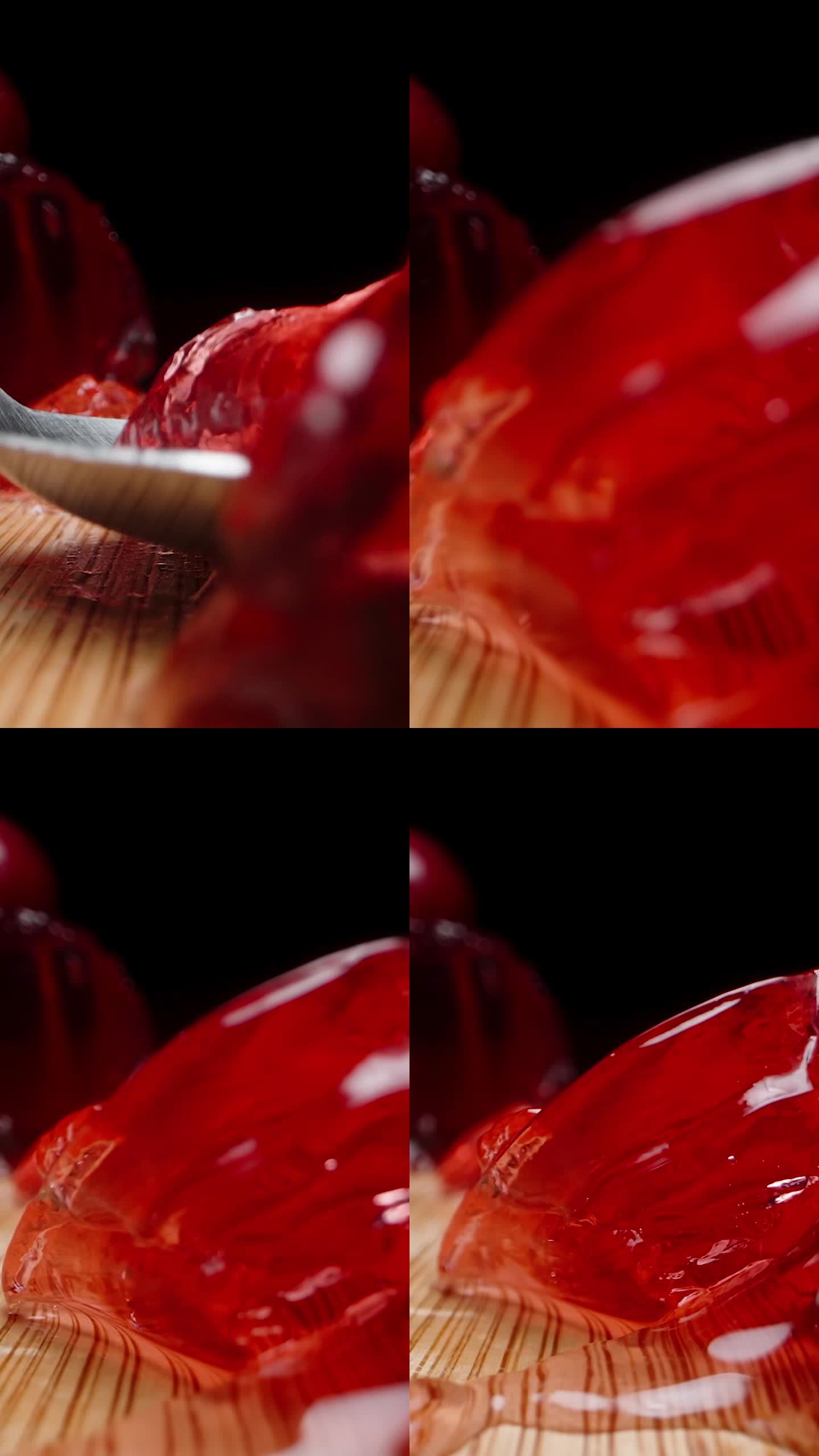 垂直视频。我用勺子吃自制的樱桃果冻。多莉滑块极端特写。