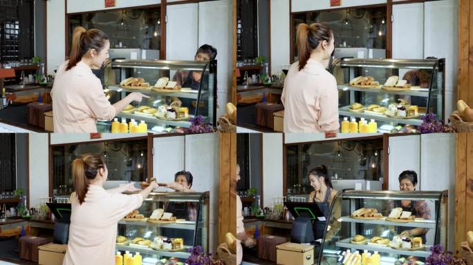 漂亮的亚洲女性顾客在面包店和咖啡店买蛋糕。上了年纪的店主围裙里的小贩在面包房卖糖。小生意。购物的概念