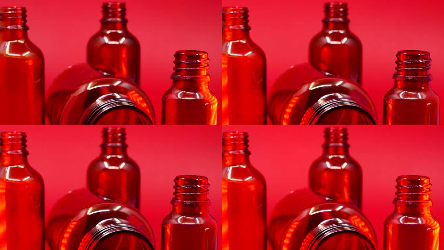 红色背景空玻璃药瓶