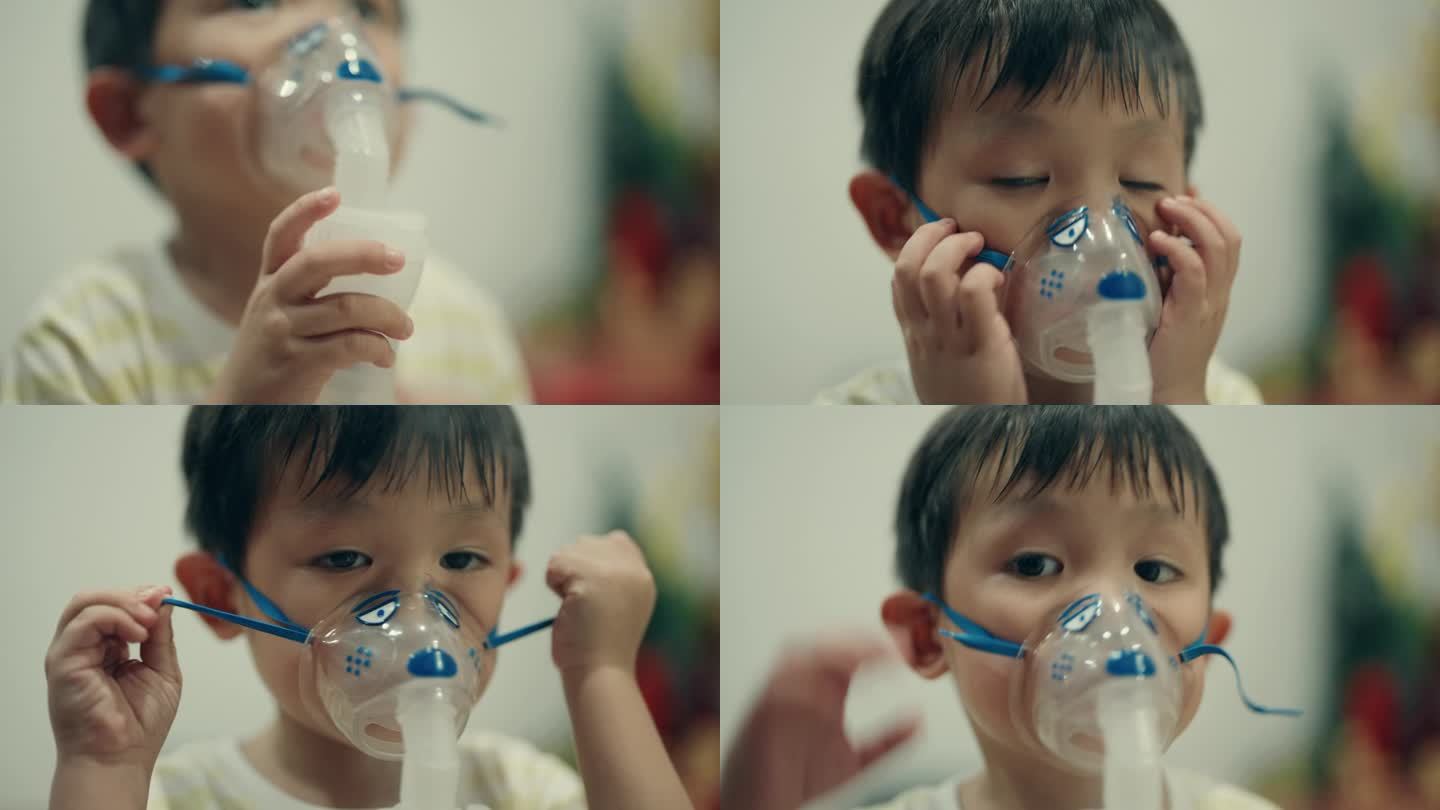 儿童疾病管理:患感冒的亚洲男孩接受雾化器治疗。
