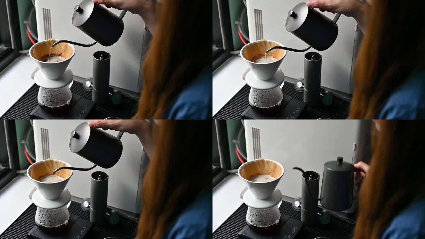 有人用滤纸将热水倒在咖啡粉上，以制作滴漏咖啡。