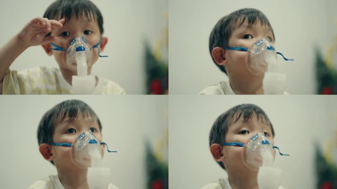 亚洲男孩接受雾化吸入治疗感冒和支气管炎。