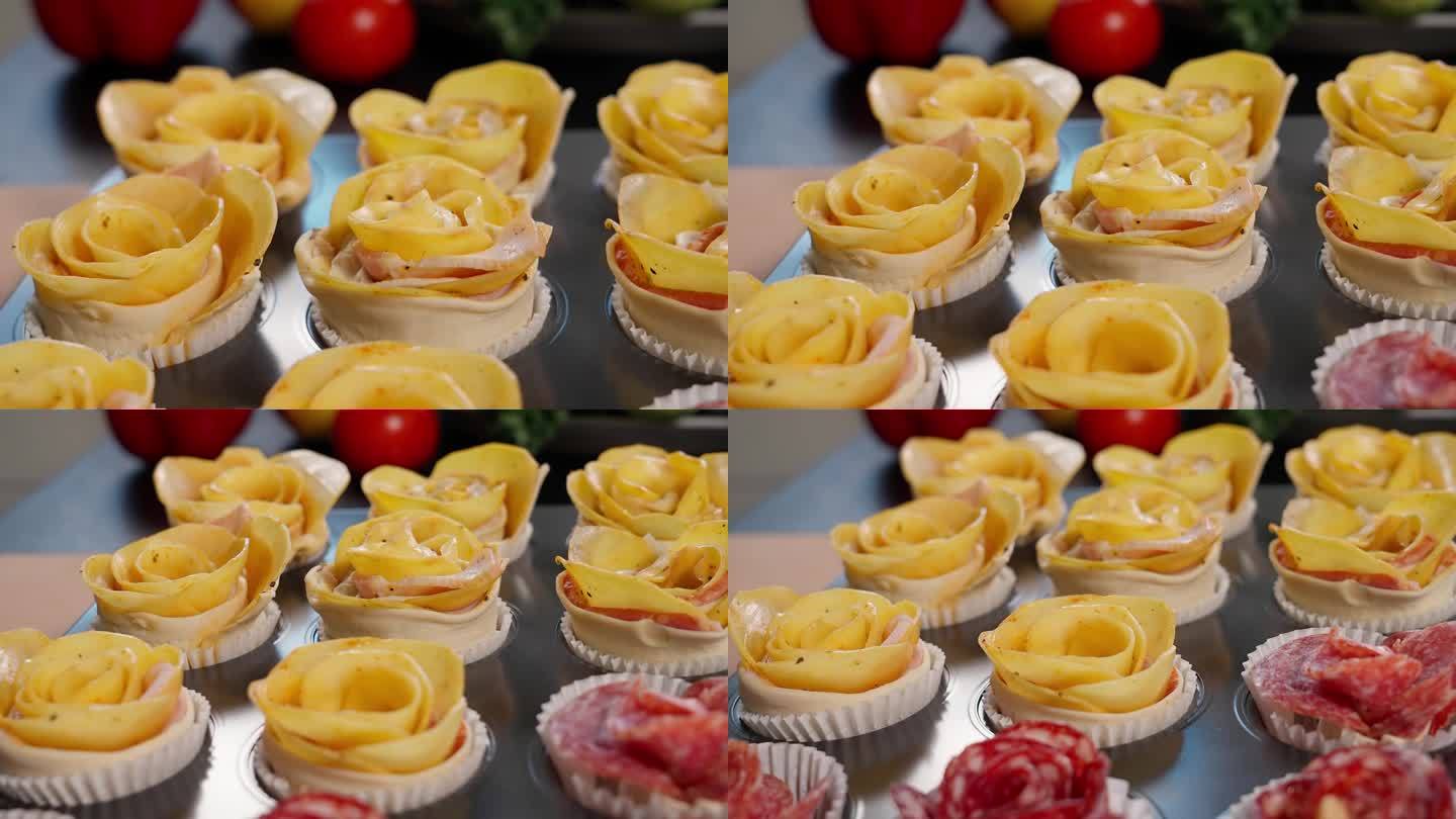面点，带馅的玫瑰形酥皮
把土豆和意大利腊肠放在松饼罐里。镜头沿着玫瑰花丛移动，正面，特写。