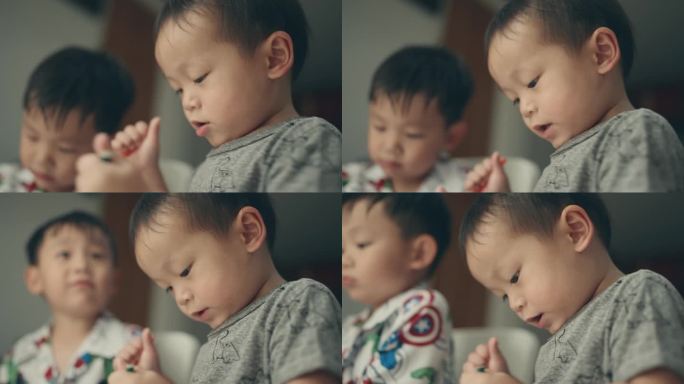 家庭艺术教育:亚洲男孩通过铅笔彩绘享受家庭作业。