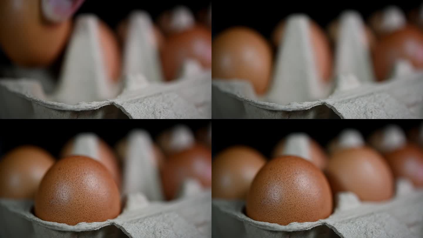 模模糊糊地看到，然后一只手看到在托盘里放了三颗鸡蛋，鸡蛋在纸托盘里，食物和烹饪。