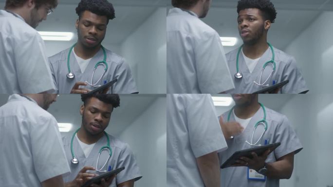 医生使用数码平板电脑，向同事展示诊断结果