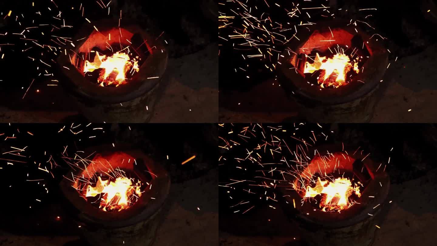 慢火在炉子里燃烧，有火花。