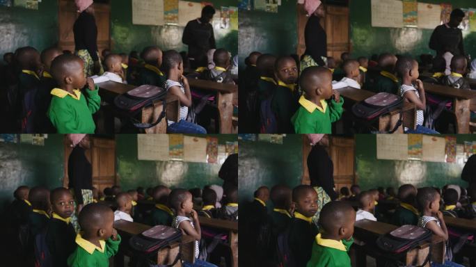 教室里男孩和女孩的慢镜头。孩子们坐在学校的课桌前。农村教育建设。