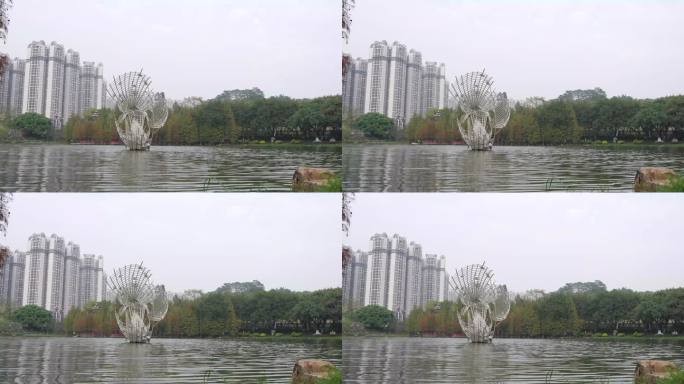 4K实拍广州黄埔创业公园人工湖雕塑与水杉