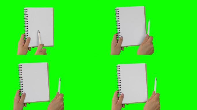 女性手持记事本与空白页隔离在绿色背景。关闭了。色度键屏幕。女人的手与空卡片纸模型。广告的姿态。笔记本