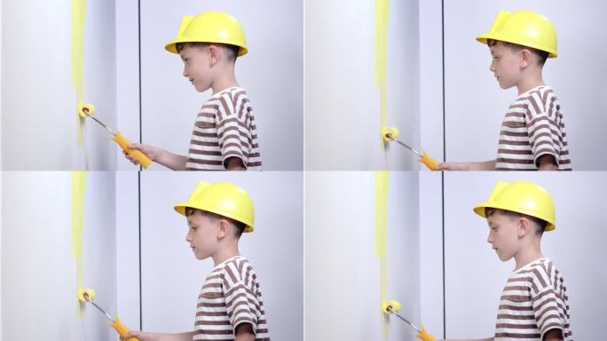 家庭装修时，男孩在墙上刷黄漆。