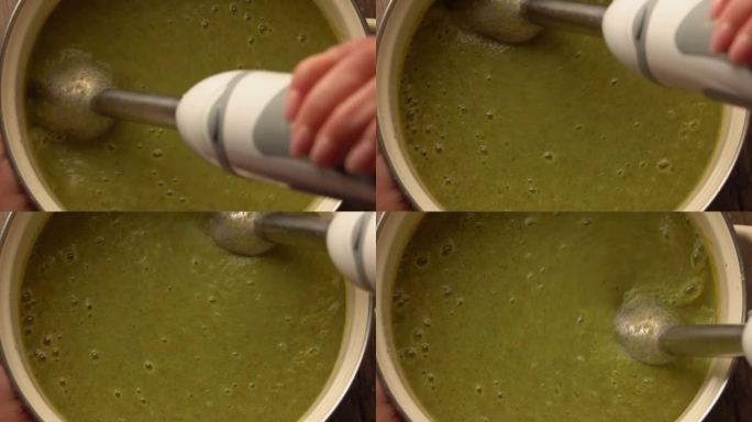 搅拌器在锅里研磨西兰花