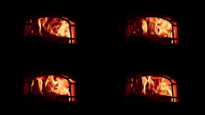 火焰在壁炉与黑暗的背景-近距离