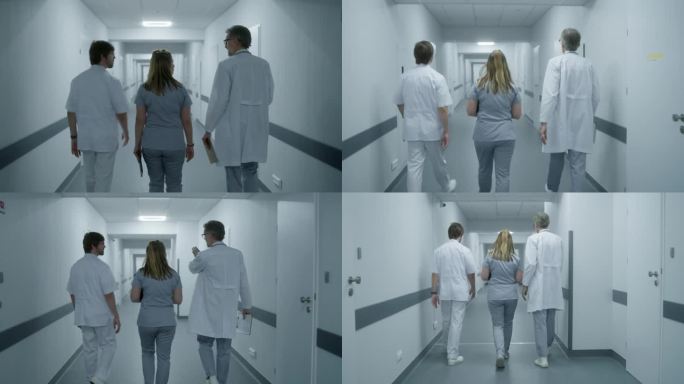 医护人员沿着现代化的诊所走廊行走