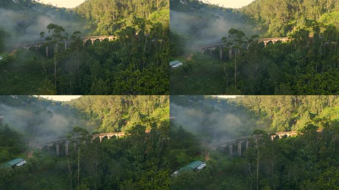 在晴朗和雾蒙蒙的早晨，在斯里兰卡艾拉，正在建立空中无人机拍摄的九拱桥