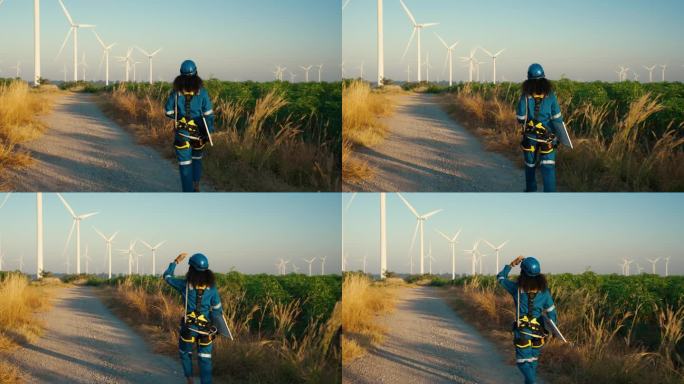 非洲女工程师用太阳能电池设备对风车领域的替代能源进行调查，用于可持续能源研究。