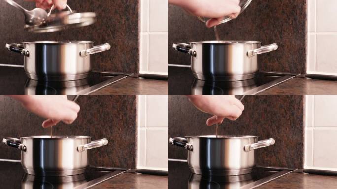 一个金属锅立在电炉上，男性双手打开锅盖，用勺子搅拌锅里的东西