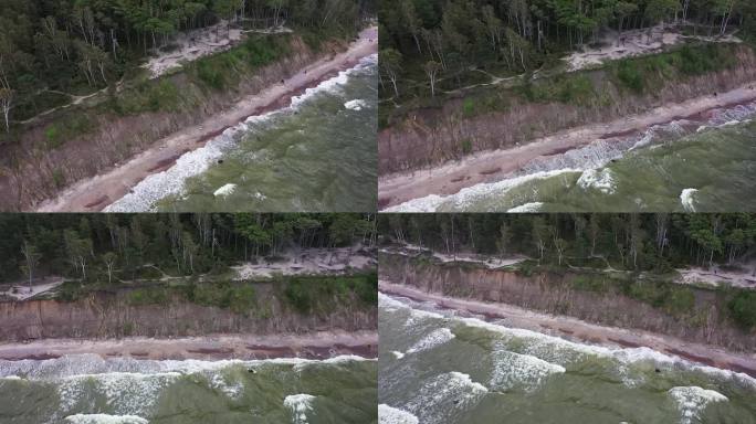 一架无人驾驶飞机揭开了立陶宛波罗的海悬崖海岸的宏伟景象，在那里，气势汹汹的海浪撞击着岩石，周围是喜怒